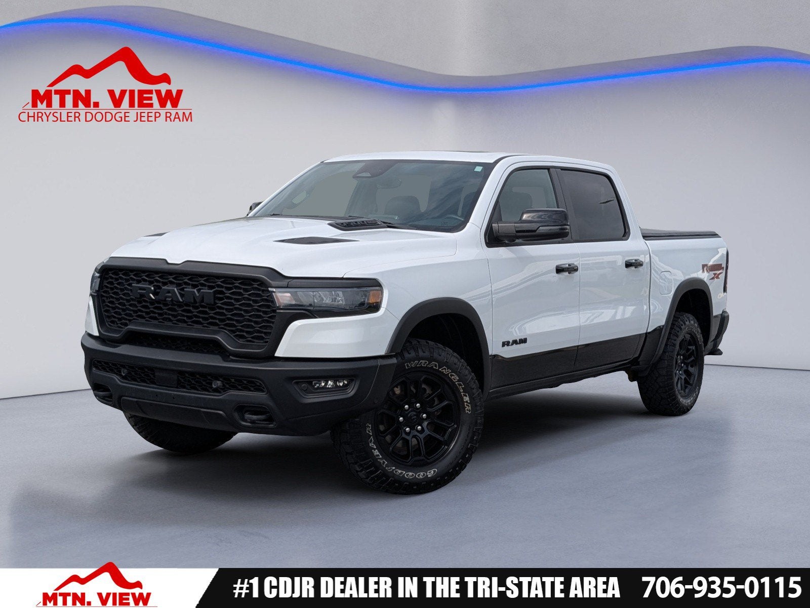 2025 RAM 1500 Rebel in Bright White Clearcoat — front three-quarter view
