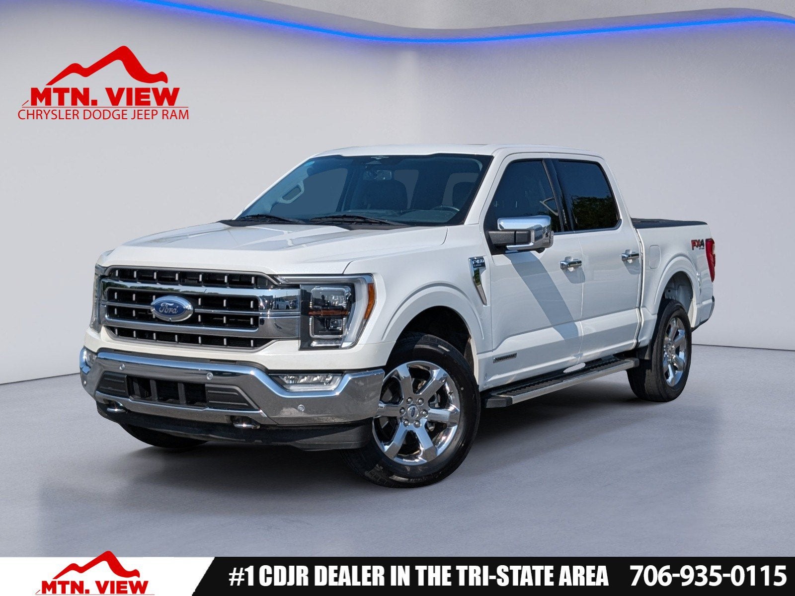 2023 Ford F-150 Lariat in White Metallic — front three-quarter view