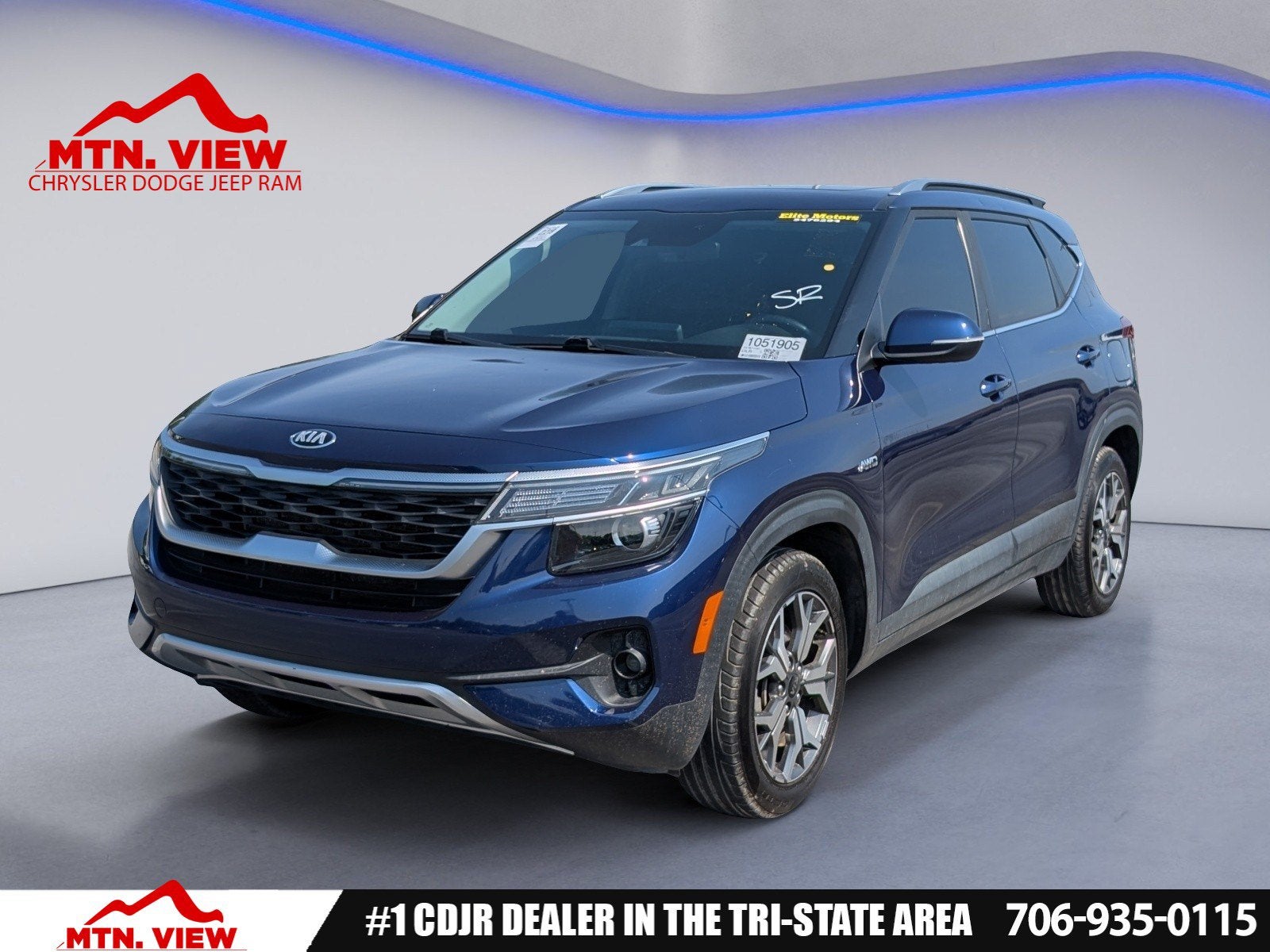 2021 Kia Seltos EX in Dark Ocean Blue — front three-quarter view